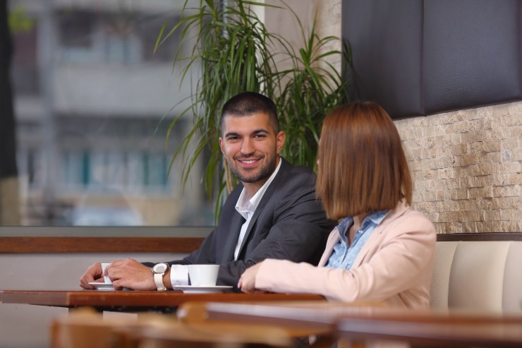 man-and-woman-business-meeting-coffee-featured-w740x493