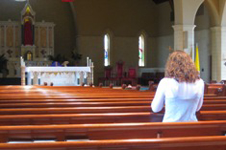 woman-praying-in-church-featured-w740x493